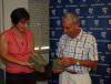 Cynthia Wroclawski, Manager of the of the Yad Vashem Shoah Victims’  Names Recovery Project presents Moshe Hofstadter with his father’s  books on behalf of Dr. Christoph Schlegel